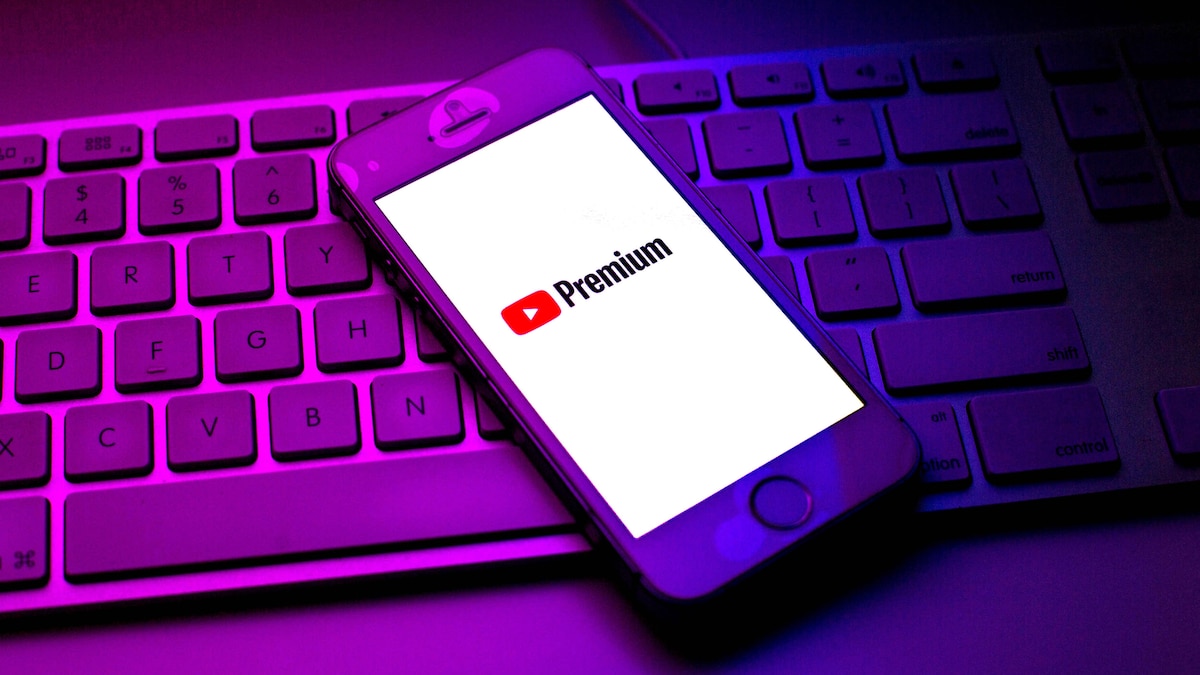 October 13, 2021, Barcelona, Catalonia, Spain: In this photo illustration a YouTube Premium logo seen displayed on a smartphone on top of a computer keyboard Barcelona Spain - ZUMAd159 20211013_zia_d159_007 Copyright: xThiagoxPrudenciox