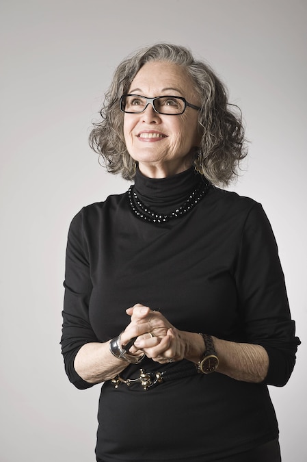 Portrait of senior woman, looking up, 24.04.2014, Copyright: xLelandxBobbex, model released, wearing,looking away,looking up,gray background,black color,gray hair,portrait,studio shot,waist up,aging,cool,active seniors,beauty,individuality,confidence,happiness,standing out from the crowd,young at heart,70 to 74 years,wavy hair,caucasian ethnicity,female,woman,senior woman,only one senior woman,eyeglasses,turtleneck,smiling,hands clasped,April 2014 Release,Gesturing,Hands Clasped,Looking Away,Looking Up,Cauc