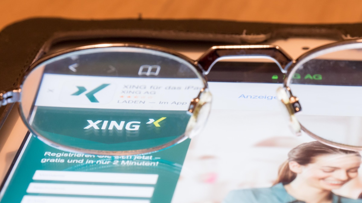 Looking at Xing, Glasses on a tablet computer framing the Xing logo on their homepage for your concepts